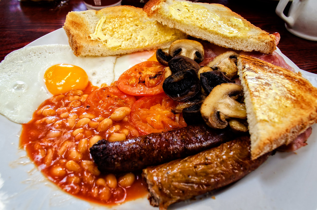 A full English breakfast with egg, sausage, black pudding, beans, mushrooms and toast