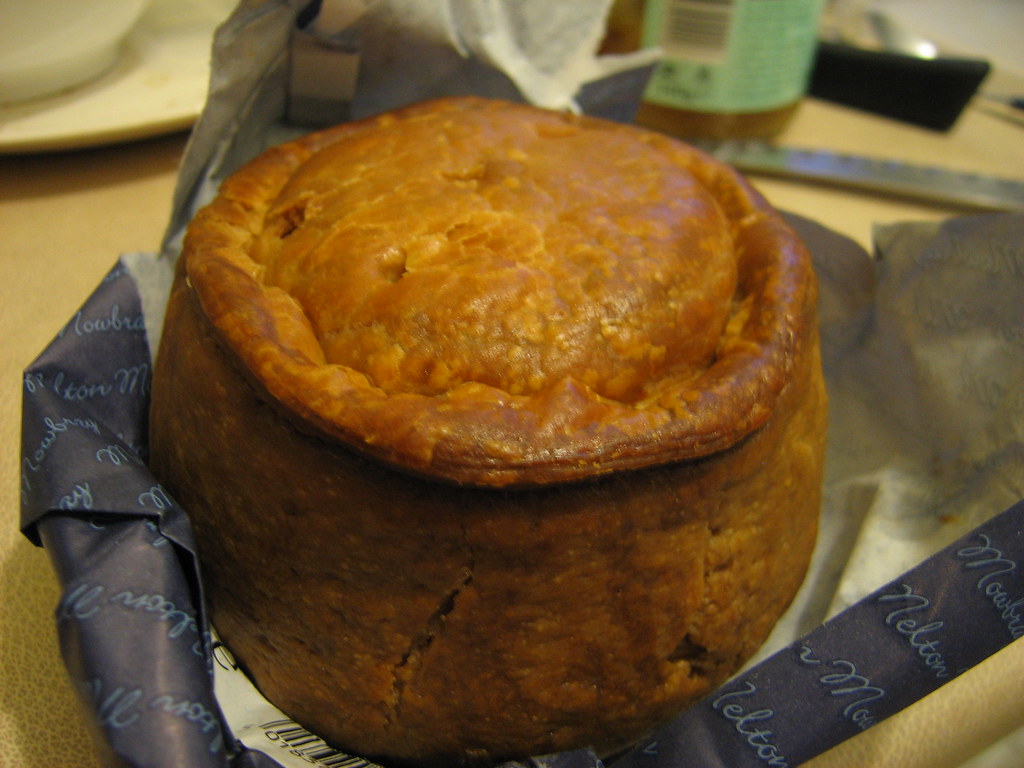 A raised pork pie with a golden hot water crust